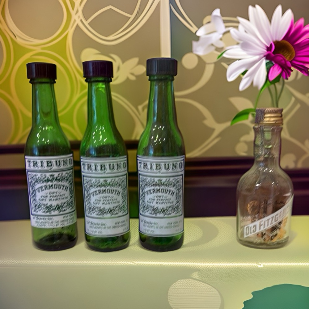 Four empty miniature bottles - Tribuno Vermouth (green) x 3 and Old Fitzgerald
